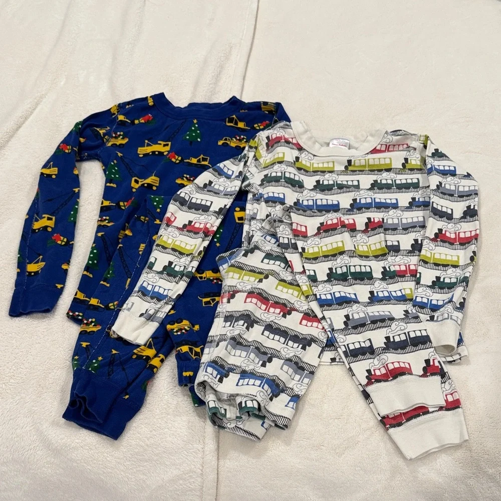 HANNA ANDERSON pajama sets. Size 8. Trains and Christmas construction vehicles. - Picture 1 of 5